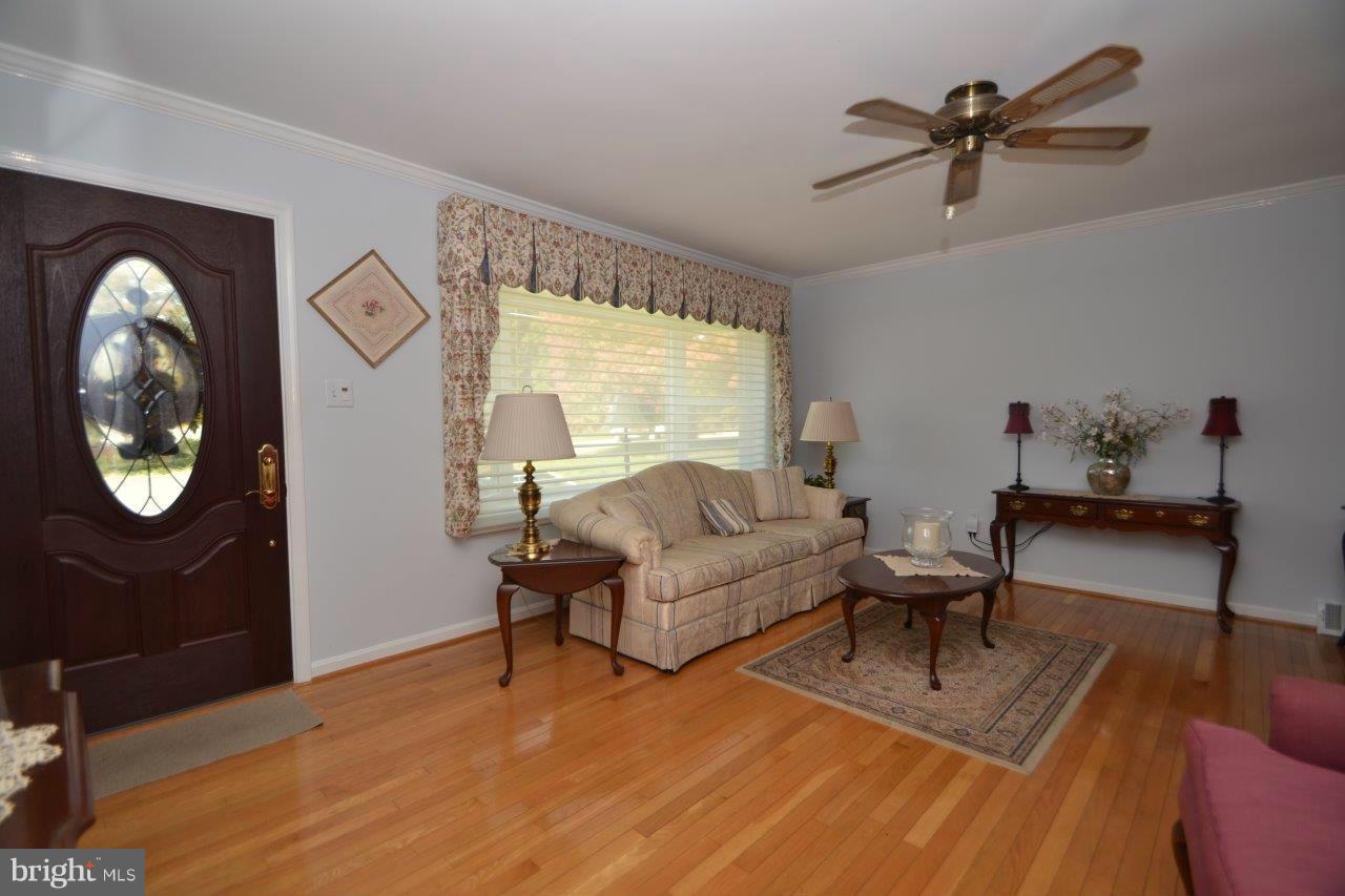 311 Bryanstone Road Reisterstown, MD 21136 - Photo 9 of 23 a living room with furniture a rug and a large window
