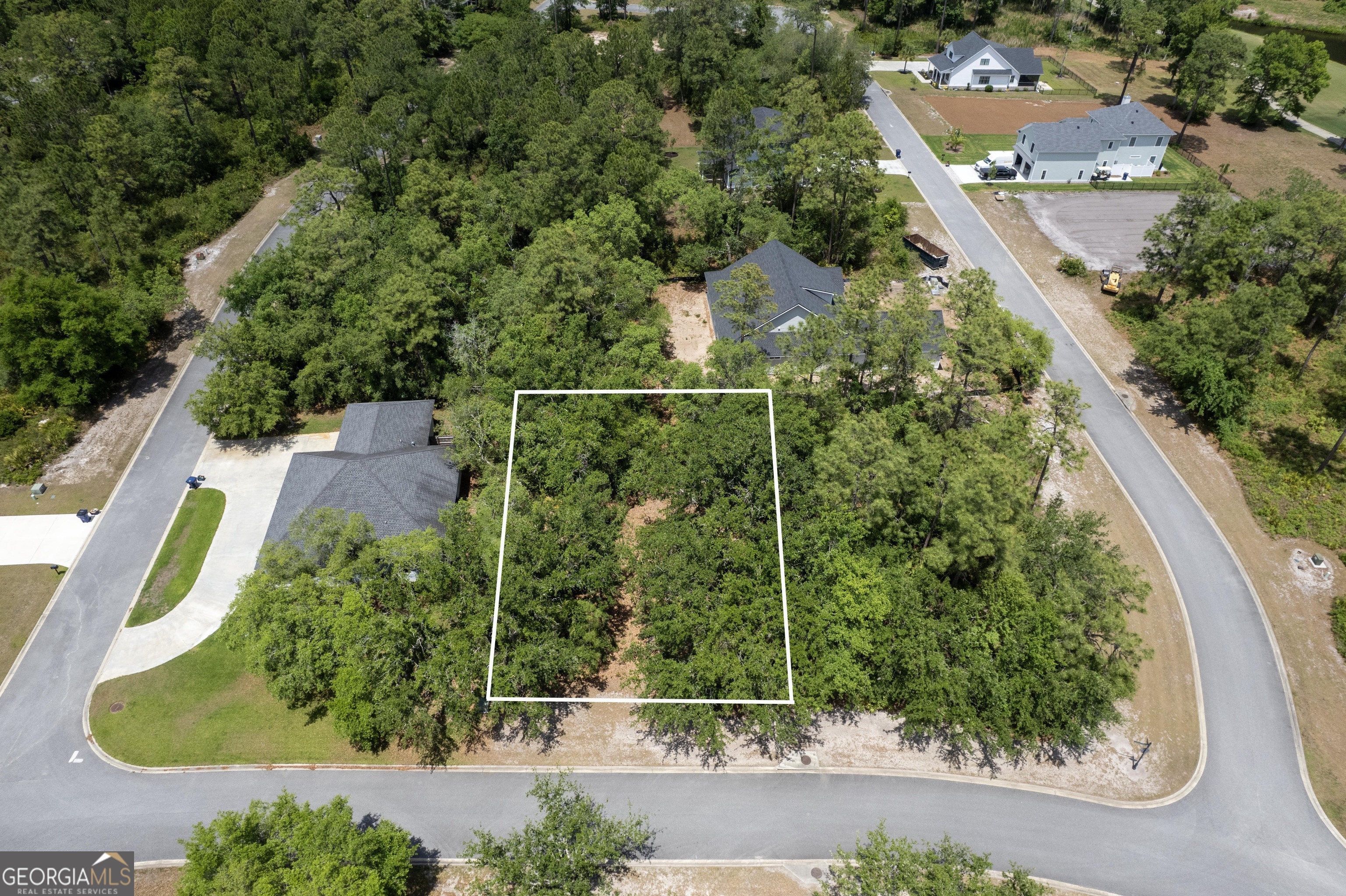 an aerial view of residential house with outdoor space and swimming pool