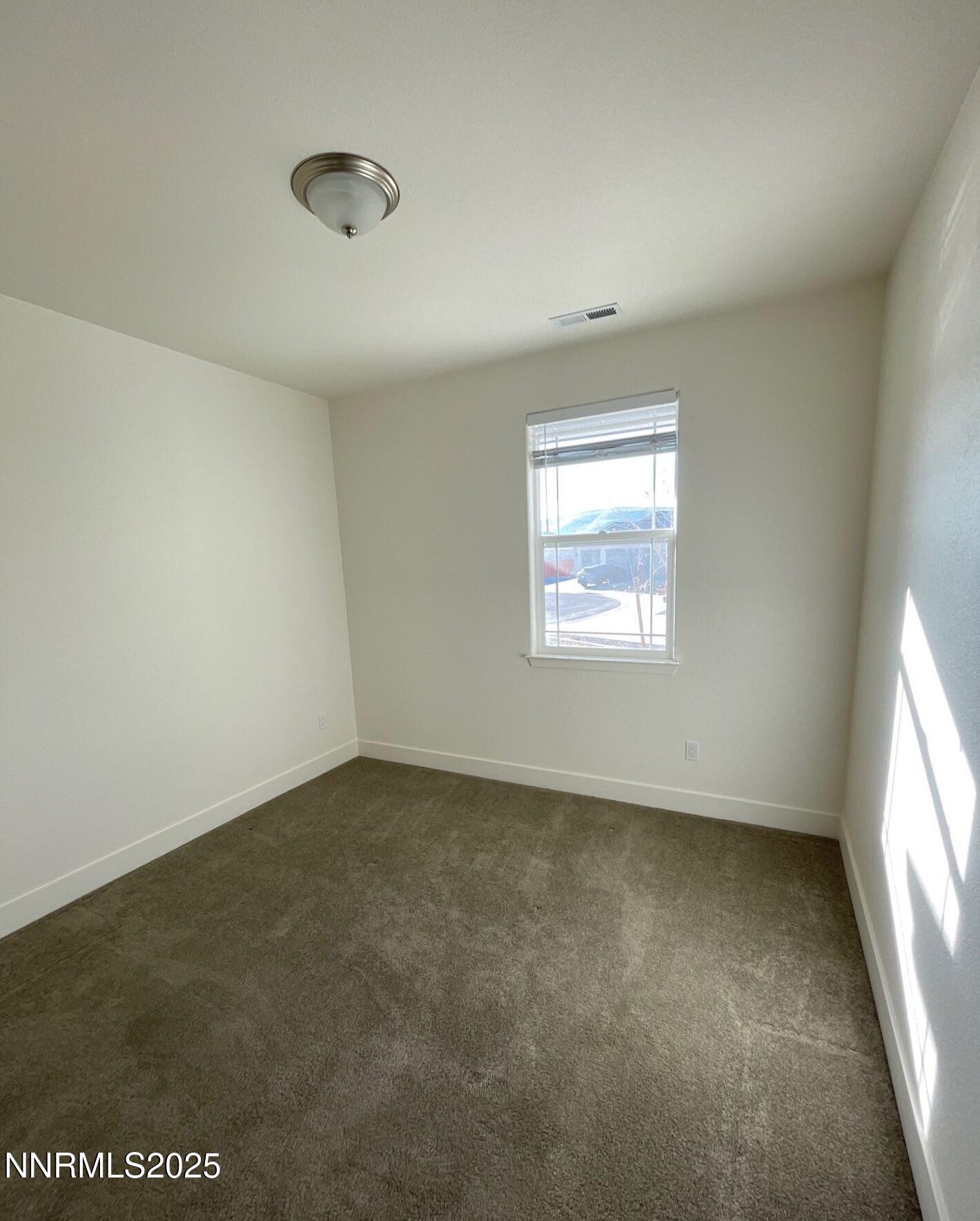 1160 Church Peak Court Reno, NV 89508 - Photo 12 of 17 an empty room with a window