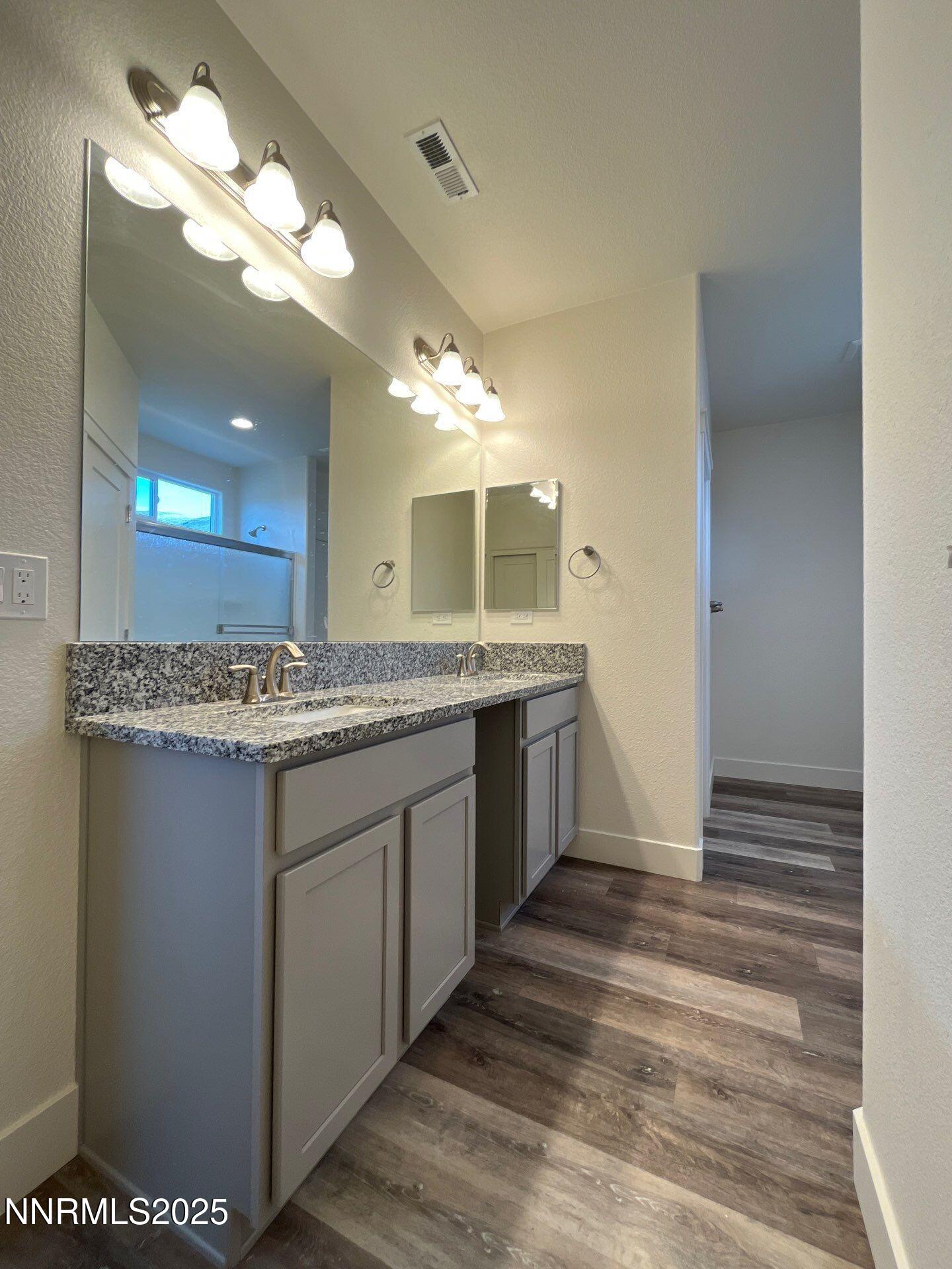 1160 Church Peak Court Reno, NV 89508 - Photo 7 of 17 a bathroom with a sink and a mirror