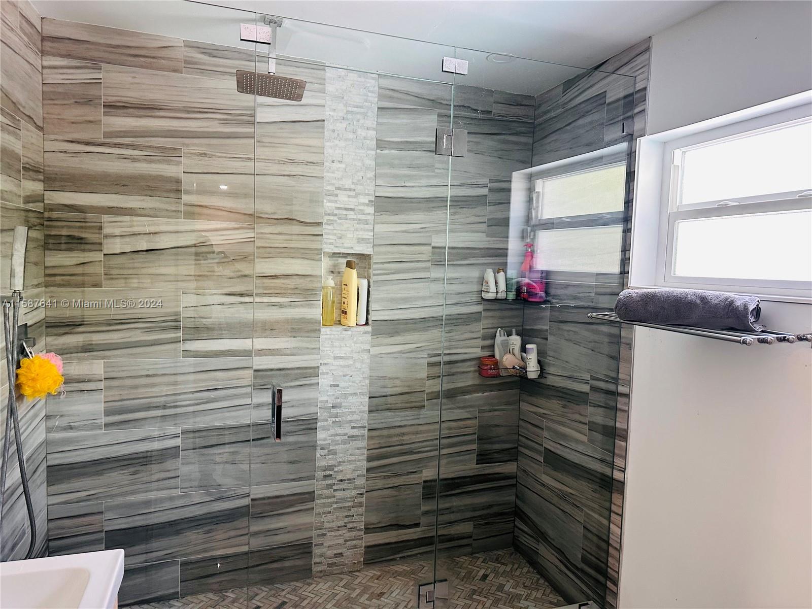 17841 Southwest 113th Avenue Miami, FL 33157 - Photo 14 of 23 a bathroom with a sink and a shower