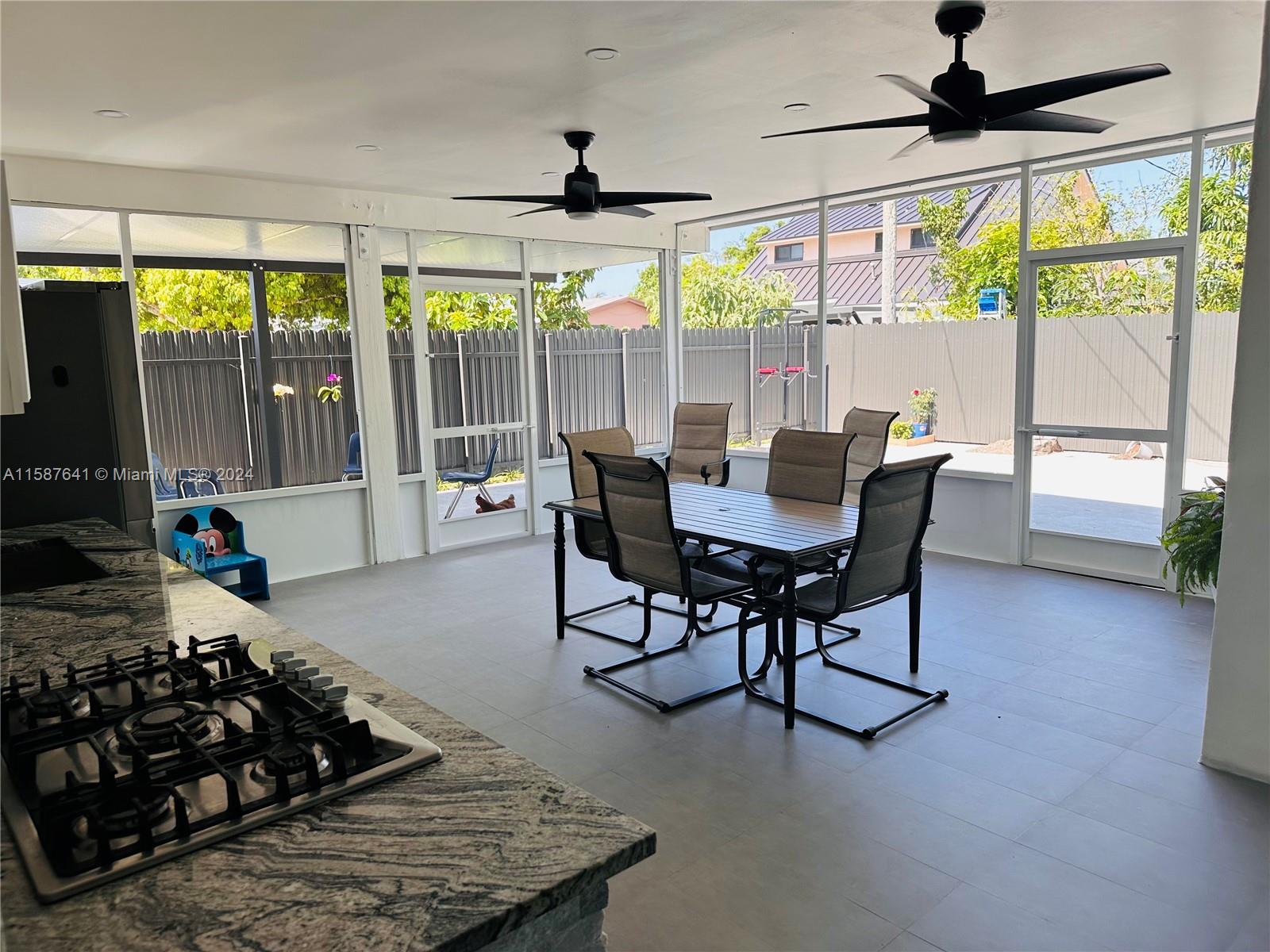 17841 Southwest 113th Avenue Miami, FL 33157 - Photo 17 of 23 a view of a dining room with furniture window and outside view