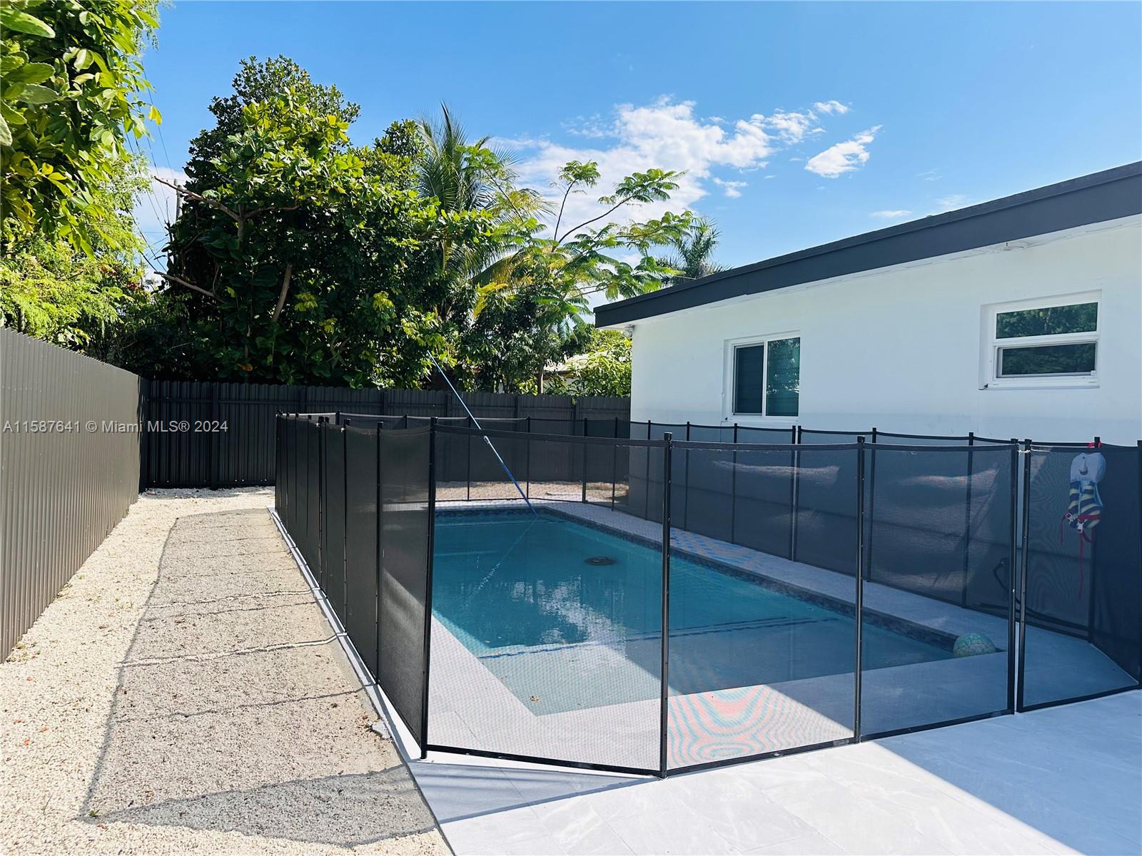 17841 Southwest 113th Avenue Miami, FL 33157 - Photo 18 of 23 a backyard of a house with lots of green space