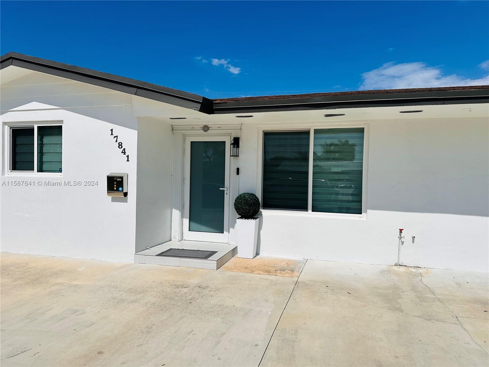 17841 Southwest 113th Avenue Miami, FL 33157 - Photo 2 of 23 front view of a house with a outdoor space
