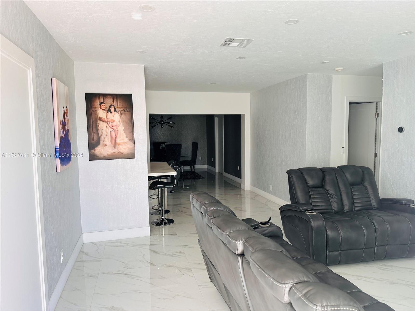 17841 Southwest 113th Avenue Miami, FL 33157 - Photo 3 of 23 a living room with furniture and a couch