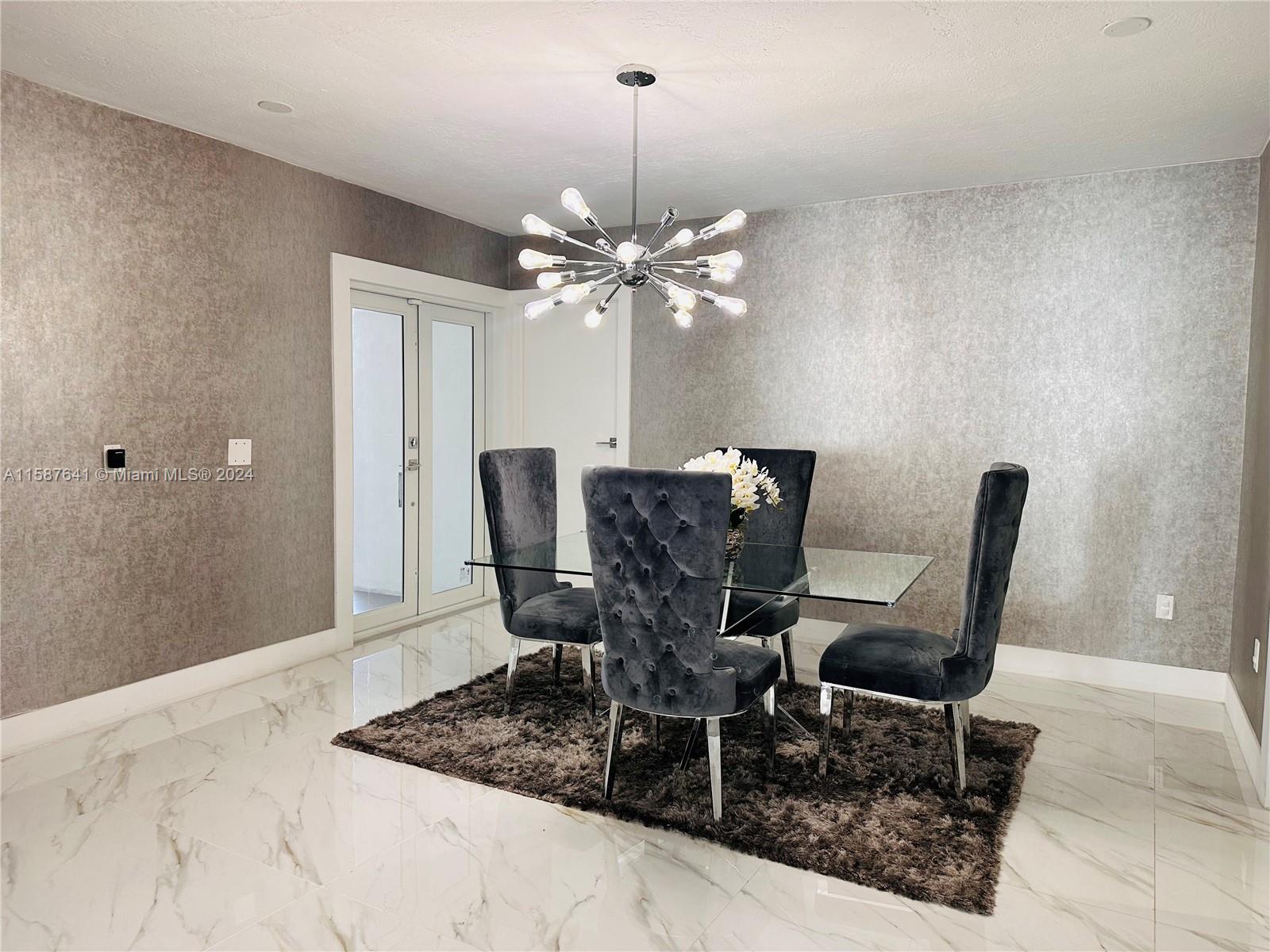 17841 Southwest 113th Avenue Miami, FL 33157 - Photo 8 of 23 a view of a dining room with furniture and chandelier