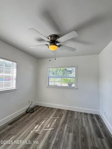 a view of an empty room and window