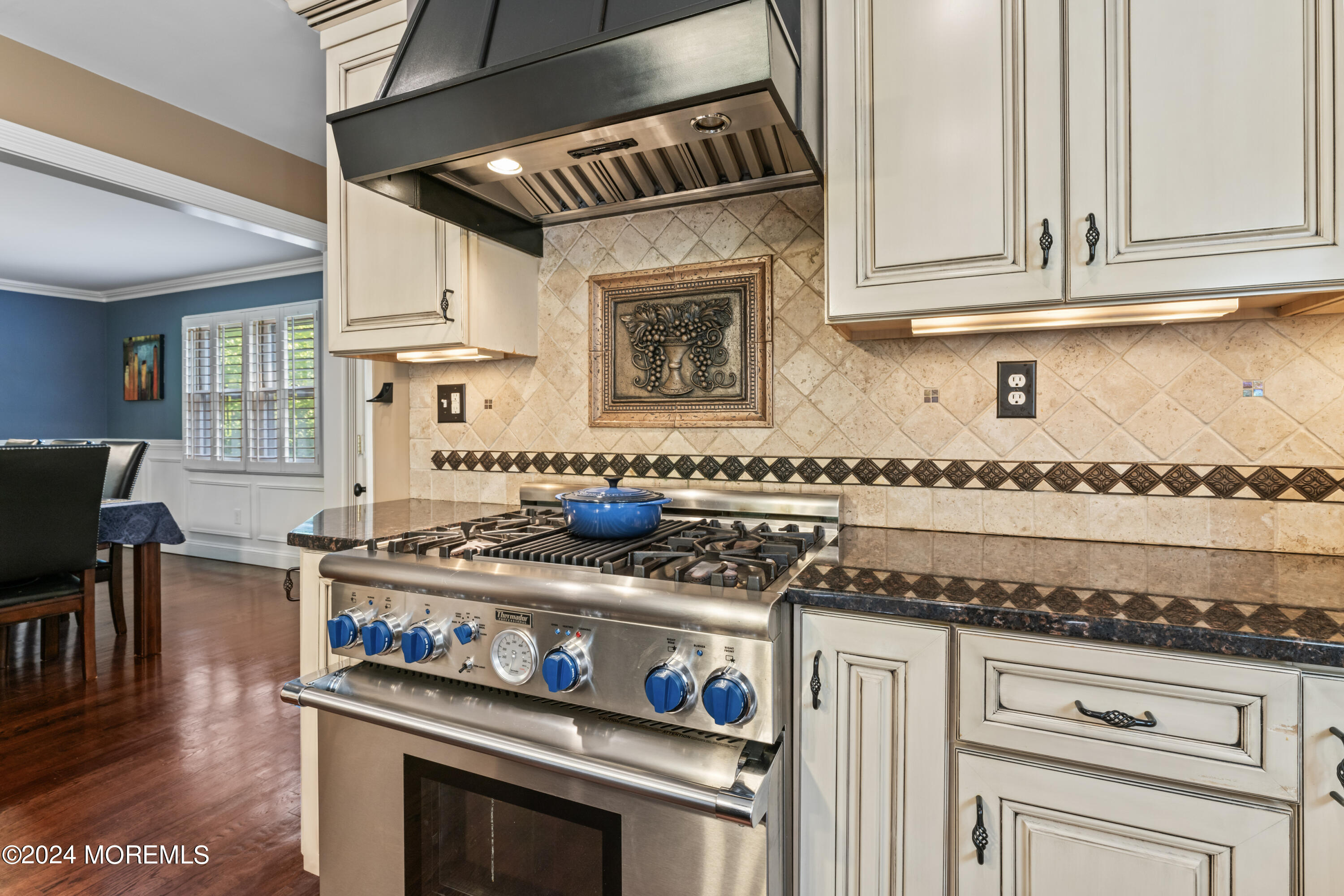 54 Rutherford Road Berkeley Heights, NJ 07922 - Photo 12 of 43 a kitchen with granite countertop a stove and white cabinets