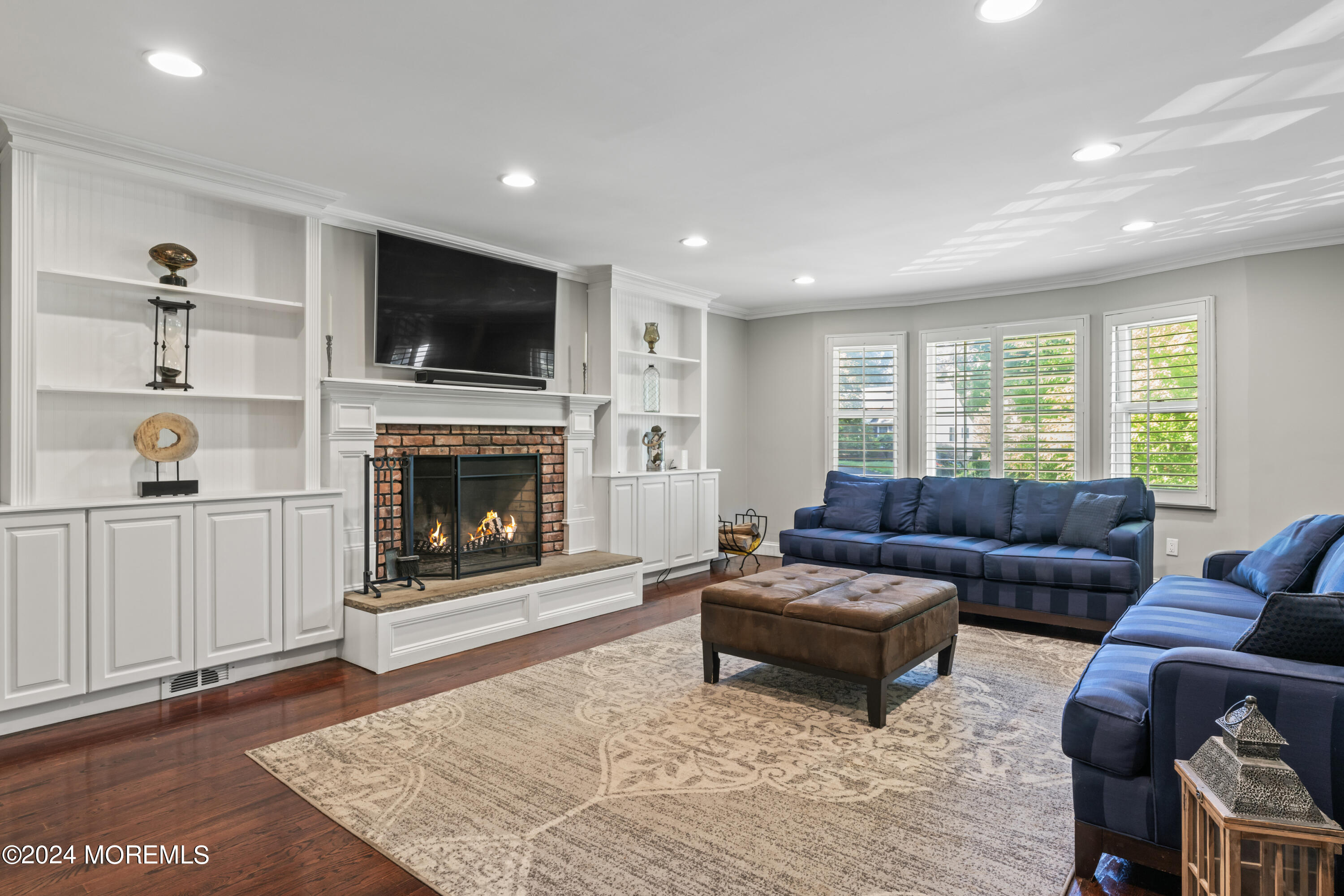 54 Rutherford Road Berkeley Heights, NJ 07922 - Photo 17 of 43 a living room with furniture and a fireplace