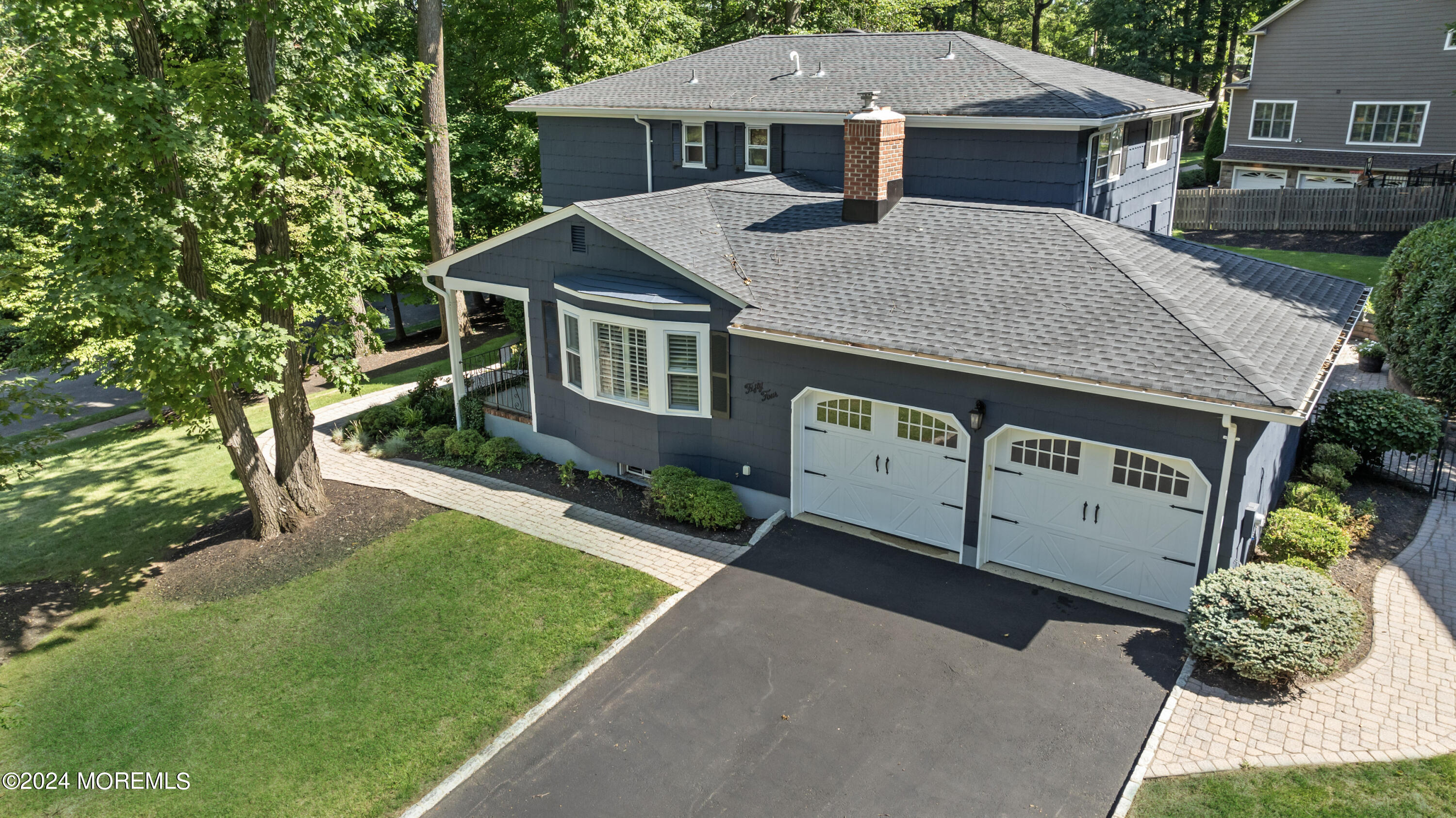 54 Rutherford Road Berkeley Heights, NJ 07922 - Photo 2 of 43 a front view of a house with a yard garage and outdoor seating