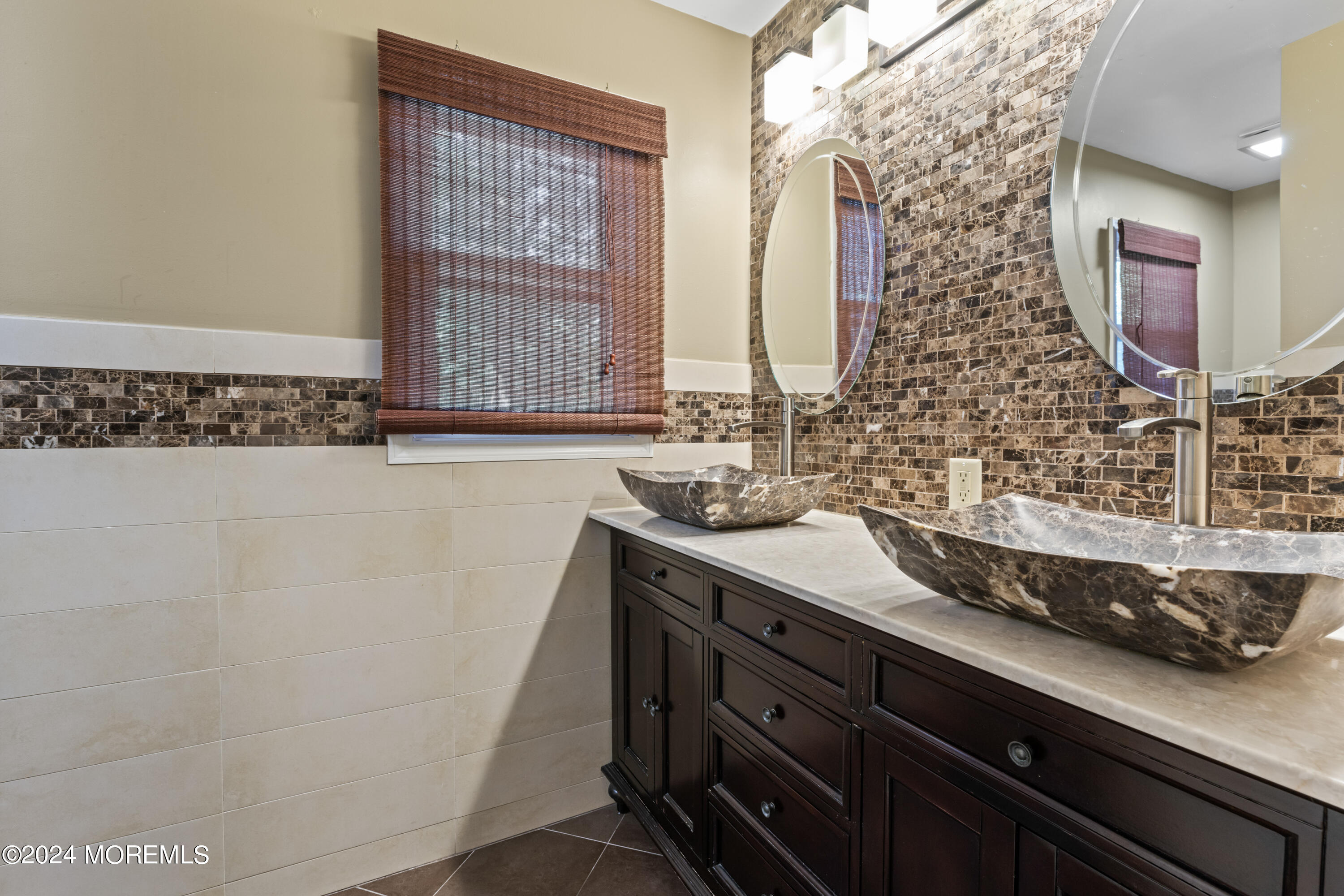 54 Rutherford Road Berkeley Heights, NJ 07922 - Photo 25 of 43 a bathroom with a double vanity sink a mirror and a bathtub