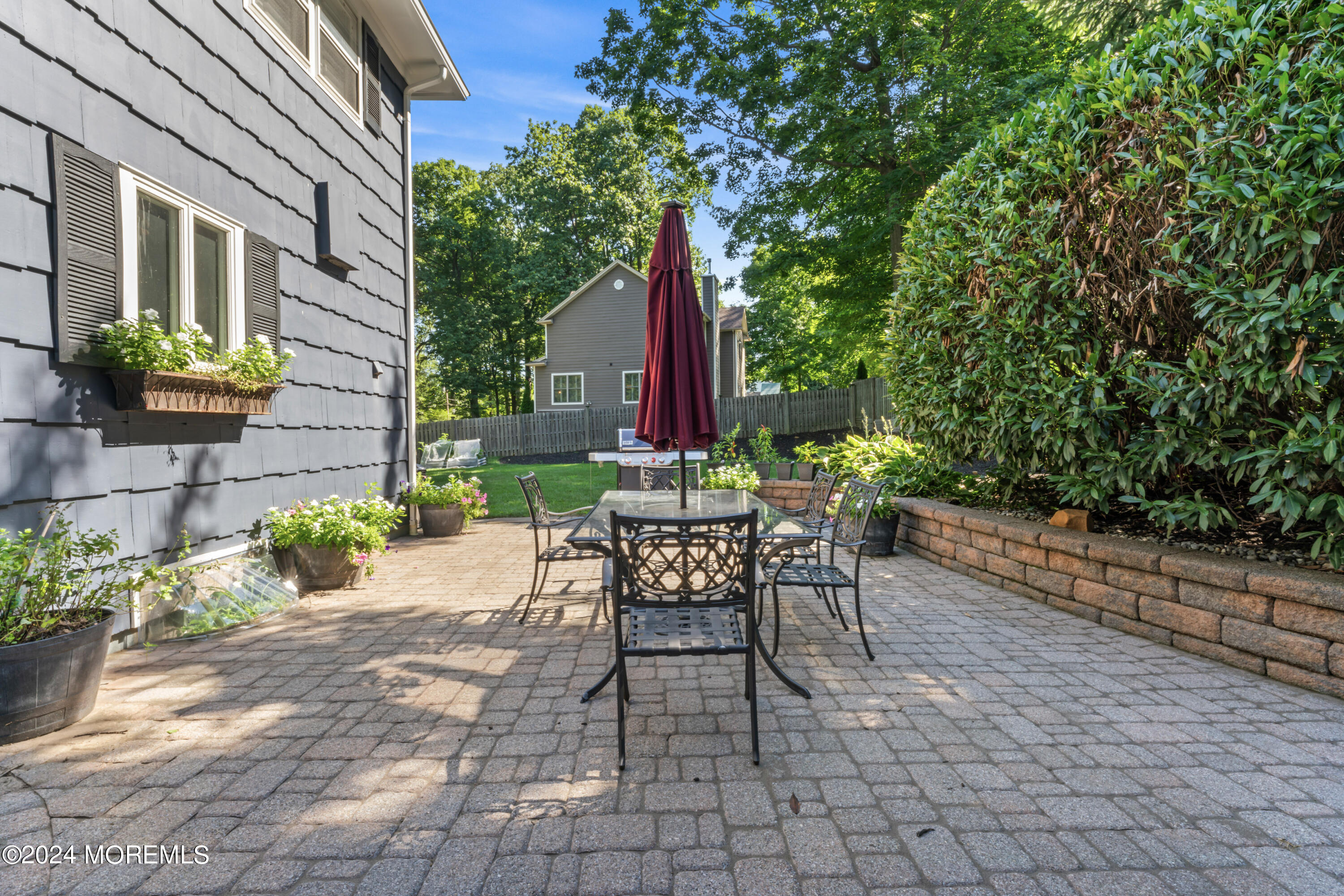 54 Rutherford Road Berkeley Heights, NJ 07922 - Photo 32 of 43 a view of a chair and table in backyard of the house