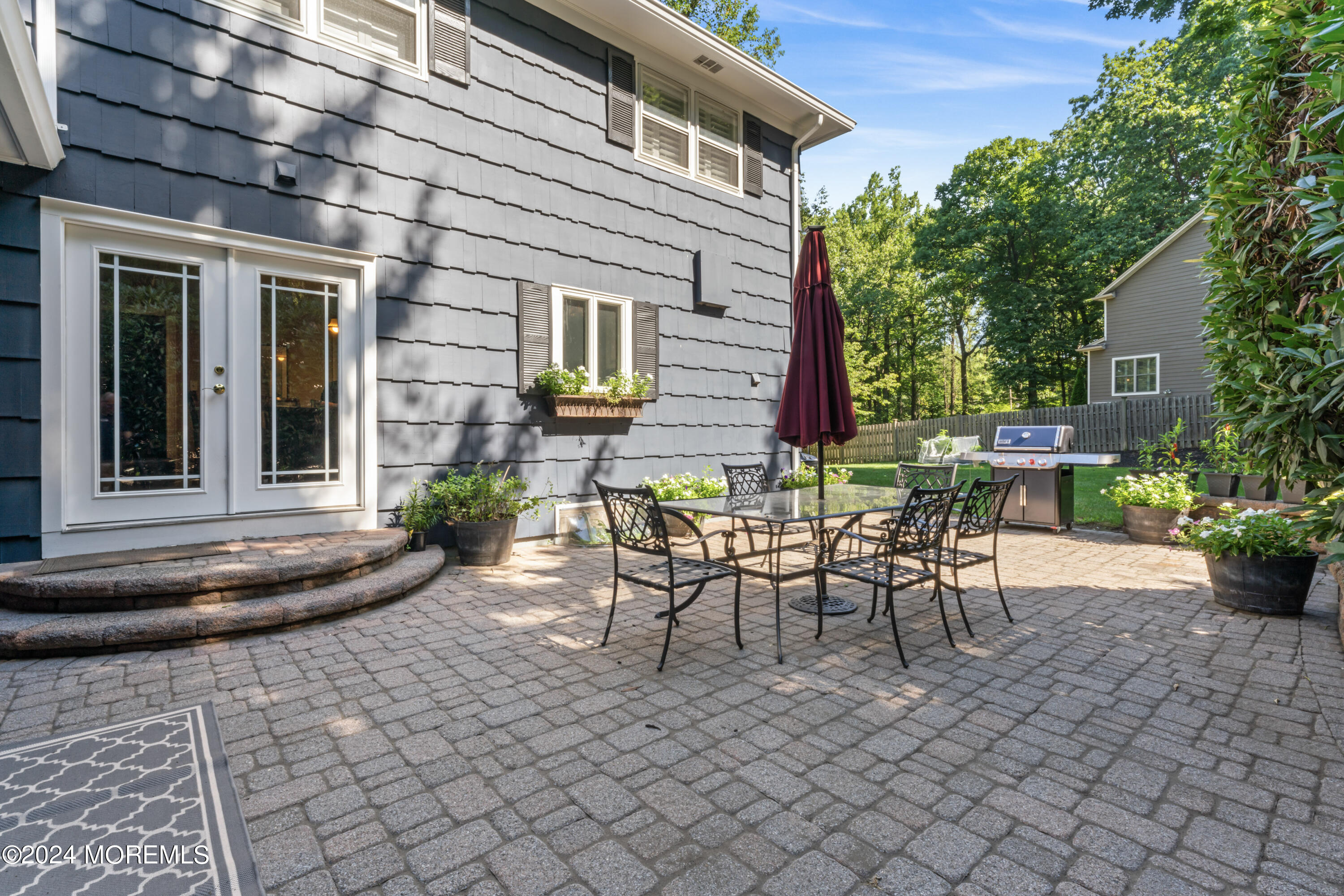 54 Rutherford Road Berkeley Heights, NJ 07922 - Photo 34 of 43 a view of a patio with table and chairs and potted plants