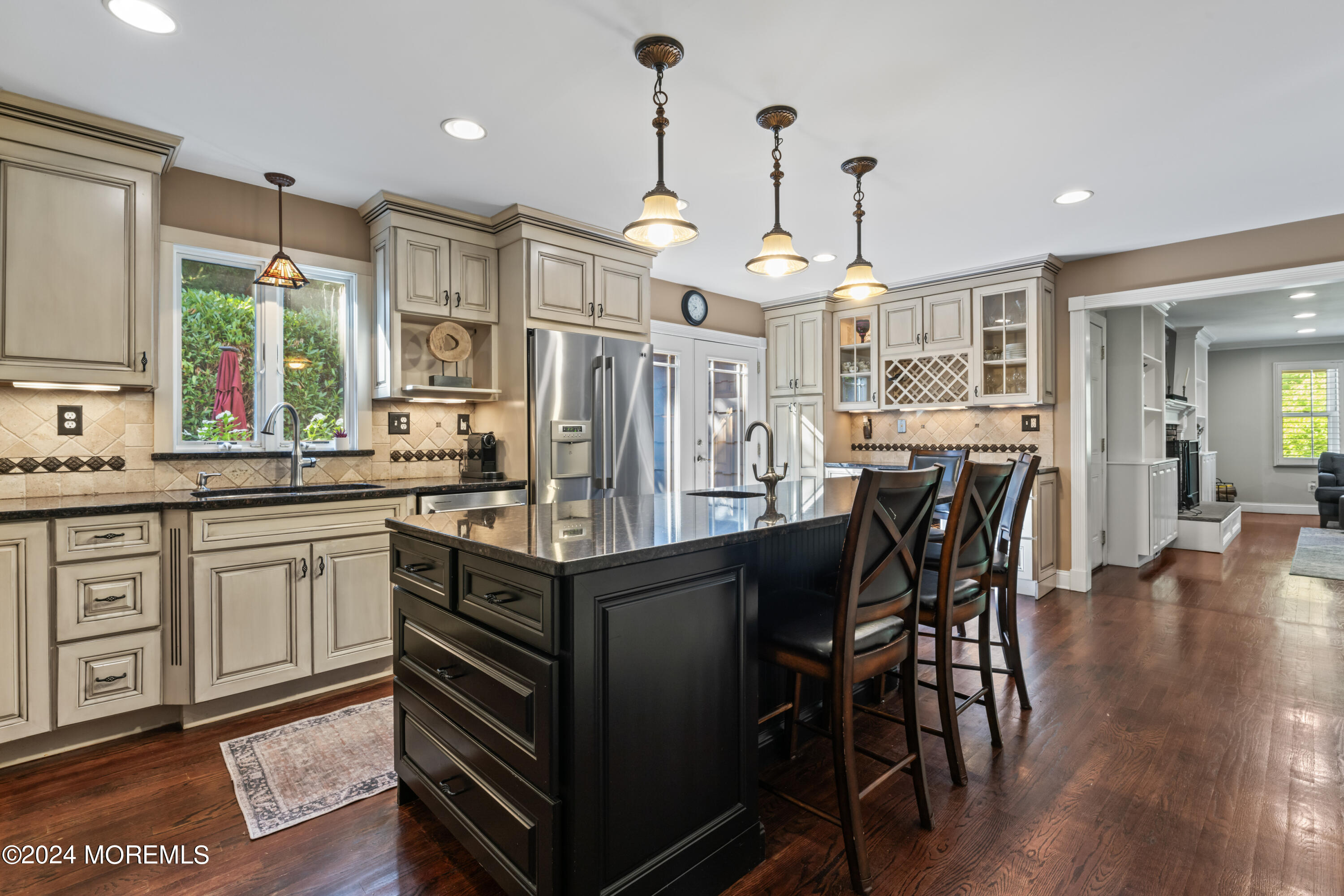 54 Rutherford Road Berkeley Heights, NJ 07922 - Photo 10 of 43 a kitchen with stainless steel appliances granite countertop a stove a sink dishwasher a dining table and chairs with wooden floor