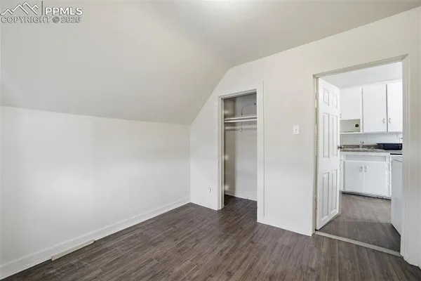 a view of kitchen with wooden floor