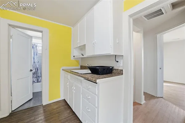 a kitchen with a stove and a refrigerator