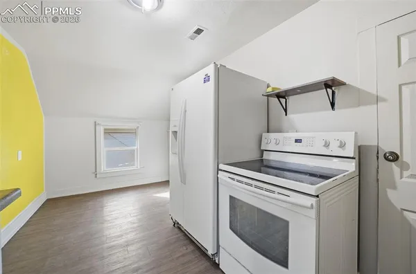 a view of a kitchen with washer and dryer