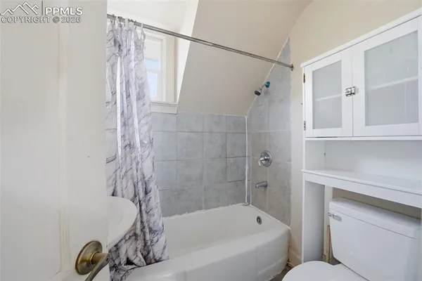 a bathroom with a shower and a tub