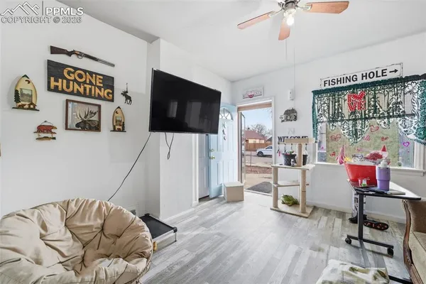 a living room with furniture and a flat screen tv