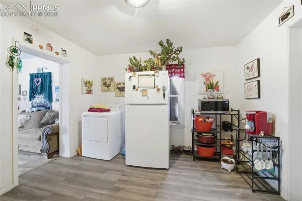 a utility room with toys and washer