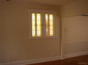5517 Fieldston Road Bronx, NY 10471 - Photo 3 of 7 a view of a small space with wooden floor and a window