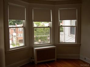 5517 Fieldston Road Bronx, NY 10471 - Photo 6 of 7 a living room with a large window