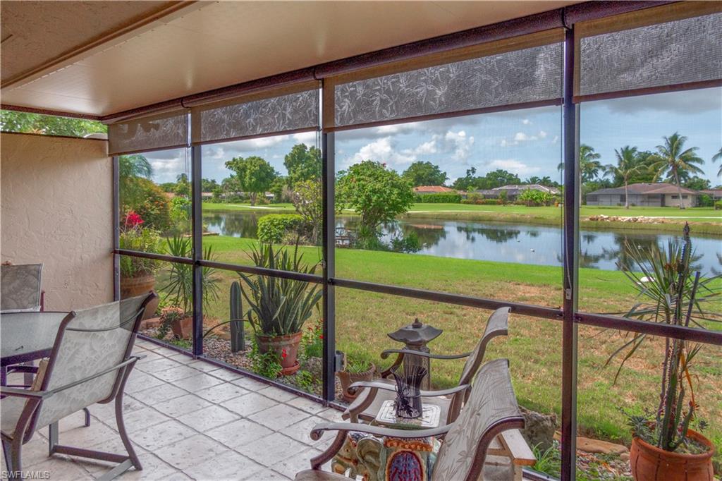 214 Torrey Pines Point Naples, FL 34113 - Photo 25 of 30 a view of a porch with furniture and garden view