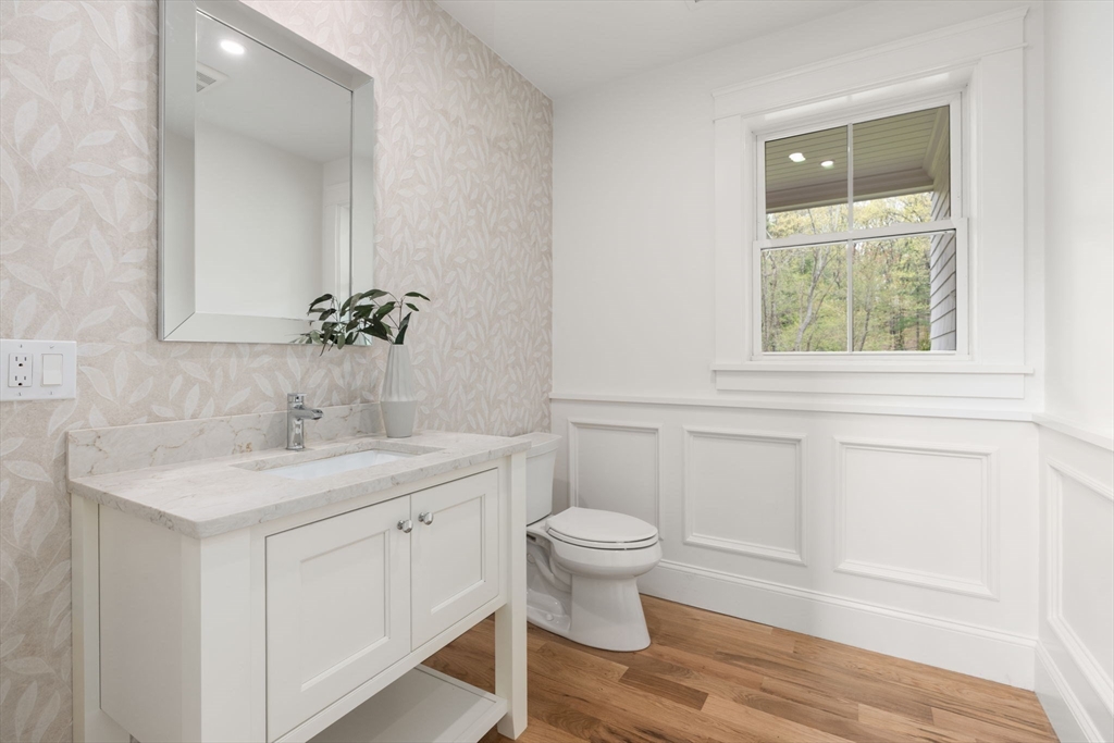 82 Deer Path Lane Weston, MA 02493 - Photo 16 of 42 a bathroom with a toilet sink and mirror