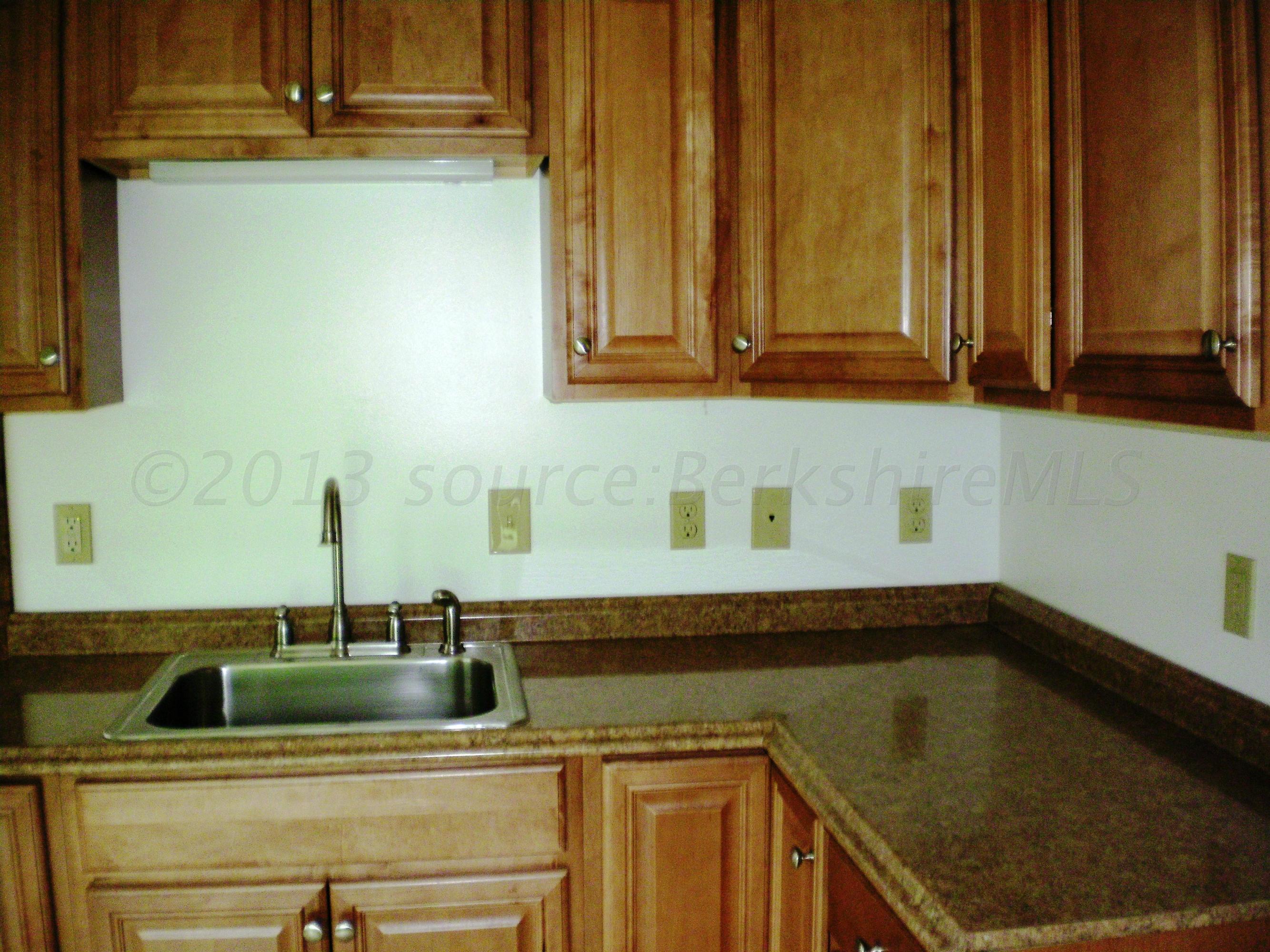 27 East Windsor Road Peru, MA 01235 - Photo 3 of 8 a kitchen with a sink and cabinets