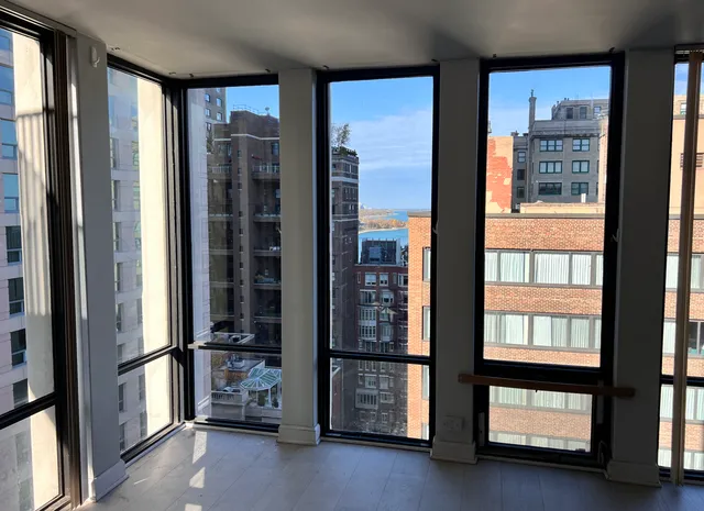a view of an entryway with a floor to ceiling window