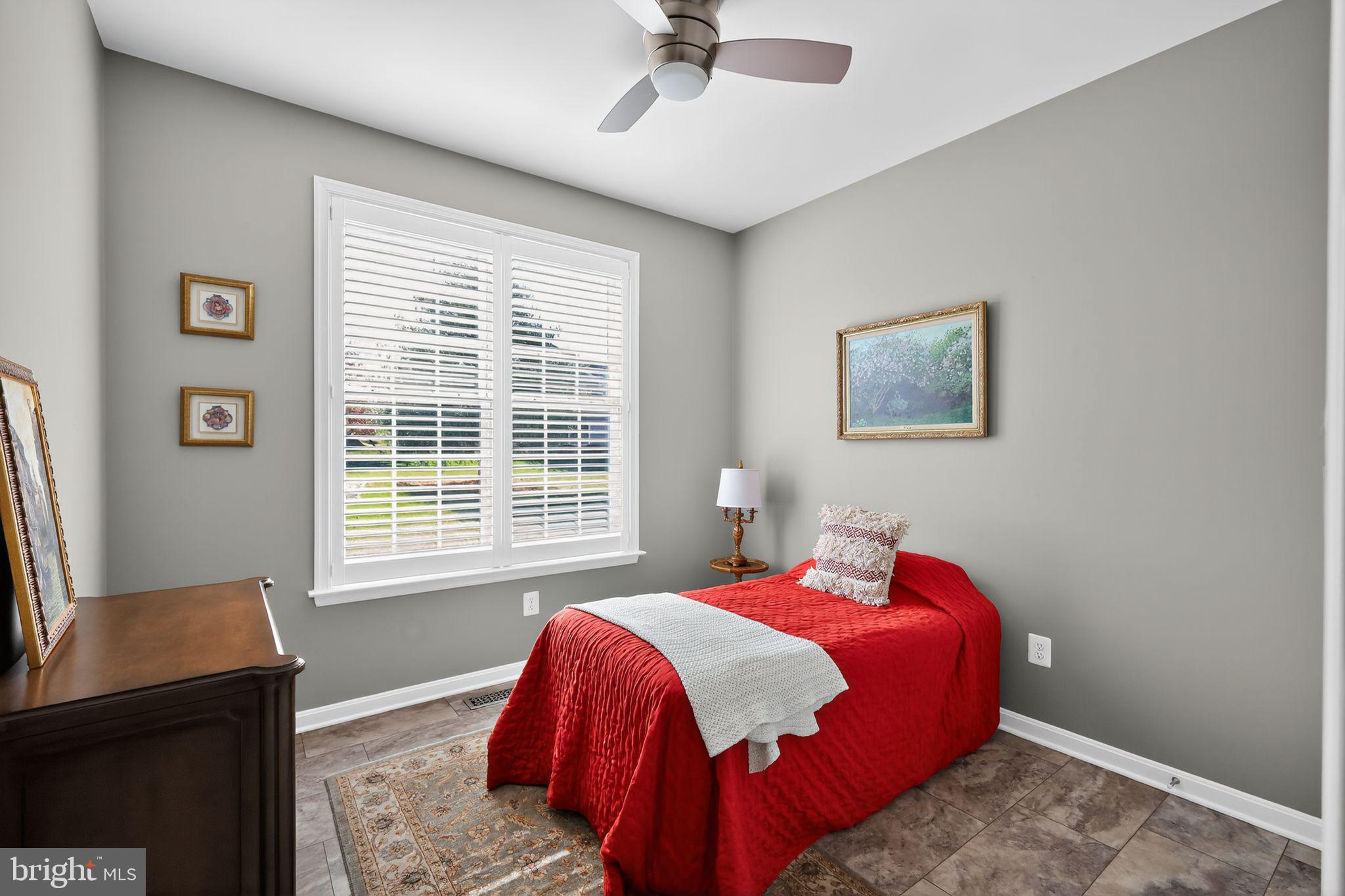 6013 Piney Grove Way Gainesville, VA 20155 - Photo 18 of 41 a bedroom with a bed and a window