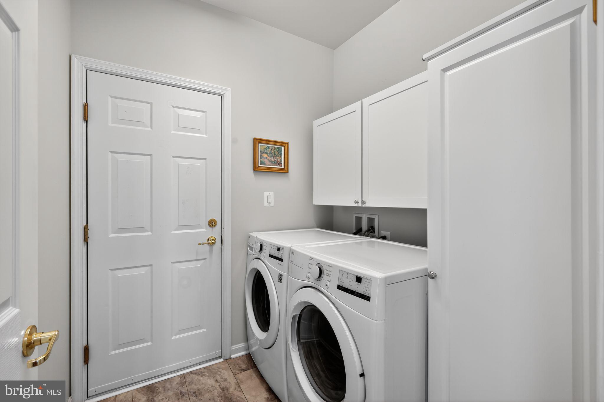 6013 Piney Grove Way Gainesville, VA 20155 - Photo 20 of 41 a utility room with dryer and washer