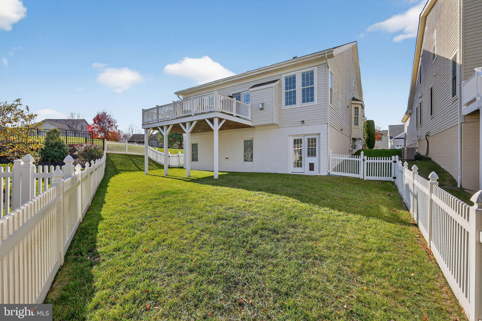6013 Piney Grove Way Gainesville, VA 20155 - Photo 25 of 41 a view of a house with backyard