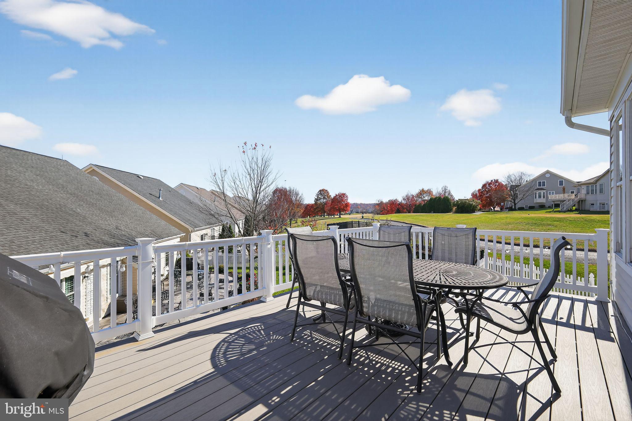 6013 Piney Grove Way Gainesville, VA 20155 - Photo 27 of 41 a view of a chairs and table on the deck