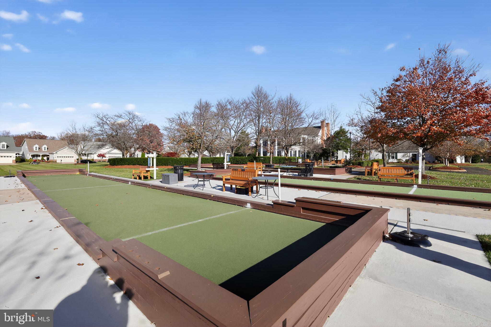 6013 Piney Grove Way Gainesville, VA 20155 - Photo 32 of 41 a view of a tennis ground with large trees