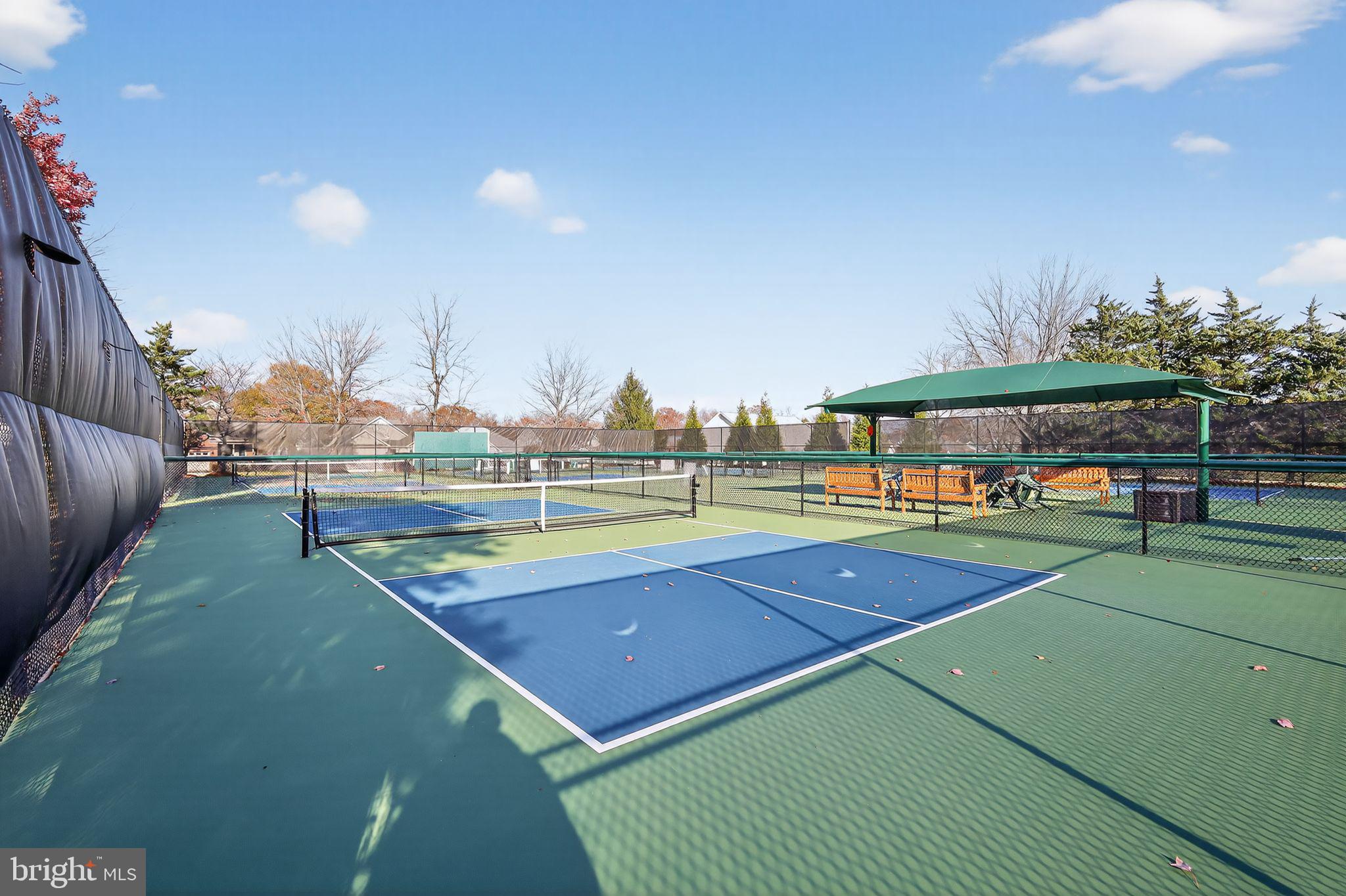 6013 Piney Grove Way Gainesville, VA 20155 - Photo 33 of 41 a view of an outdoor space and tennis court