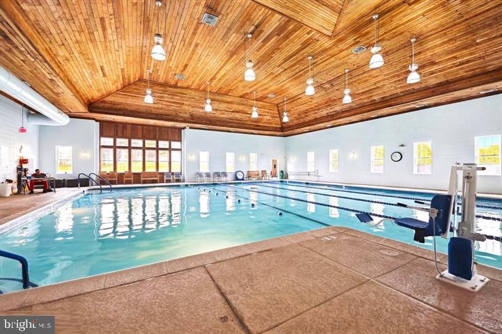 6013 Piney Grove Way Gainesville, VA 20155 - Photo 36 of 41 a lobby with a table and chairs
