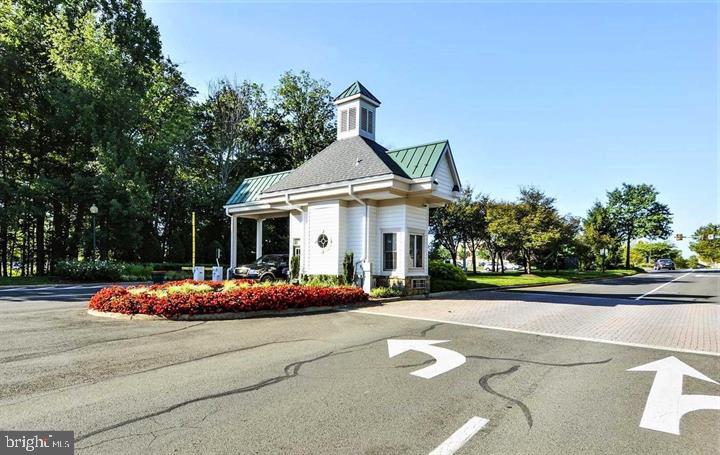 6013 Piney Grove Way Gainesville, VA 20155 - Photo 41 of 41 a front view of a house with garden