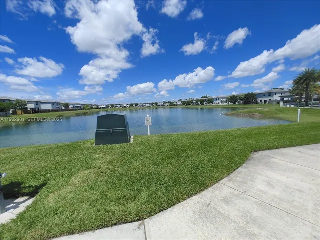 a view of a lake with a big yard