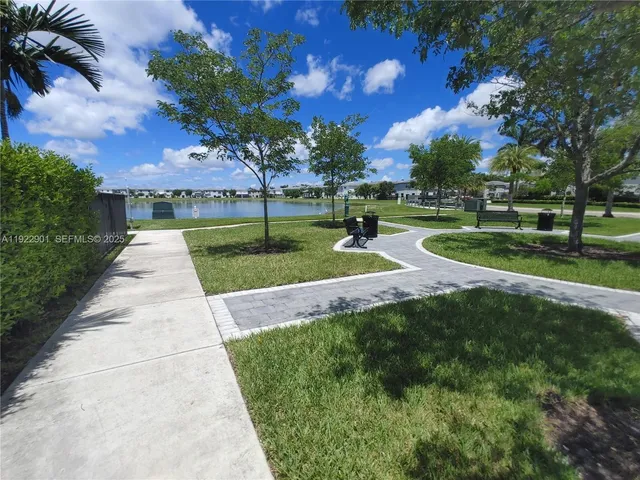a view of a swimming pool and lounge chairs