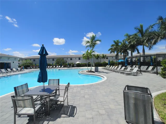 a view of a patio with chairs and tables