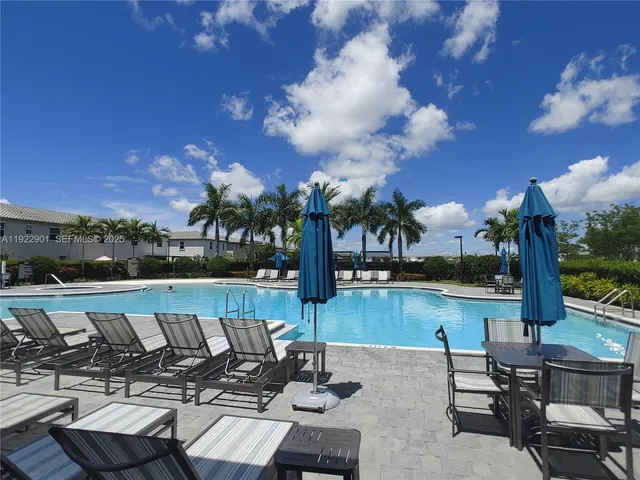 a view of a hallway with seating area