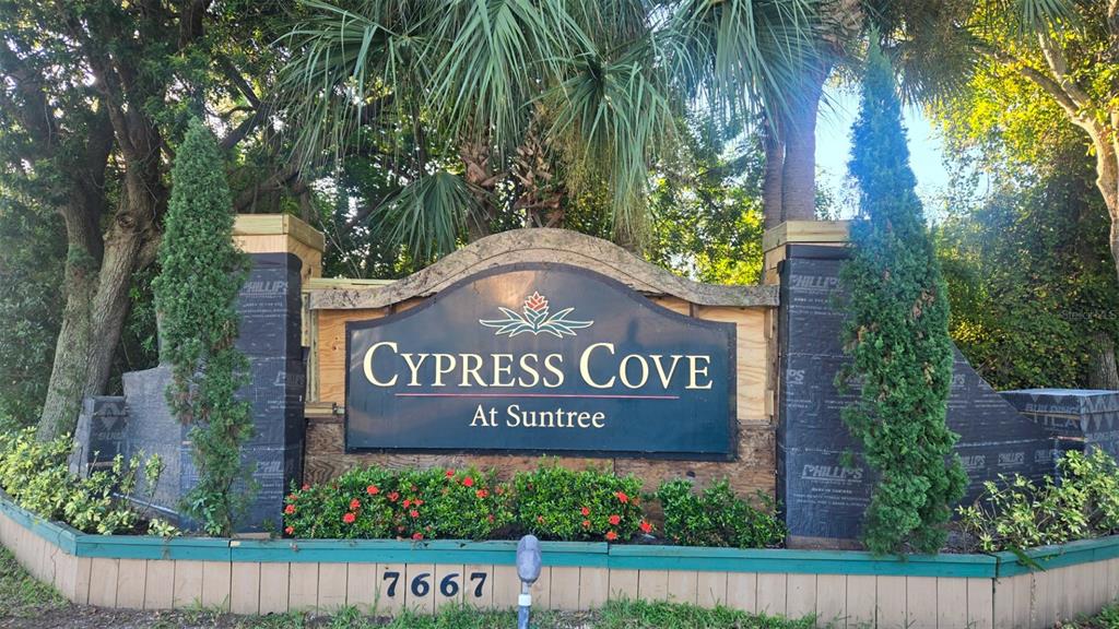 7667 North Wickham Road, Unit 522 Melbourne, FL 32940 - Photo 25 of 25 a sign that is sitting on a brick wall