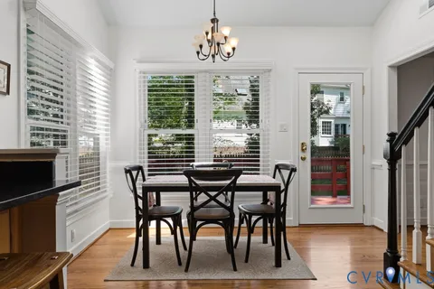 a view of a livingroom with furniture window and wooden floor