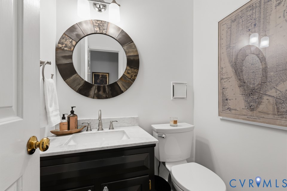 3009 Sable Road Henrico, VA 23233 - Photo 21 of 51 a bathroom with a toilet a sink and mirror