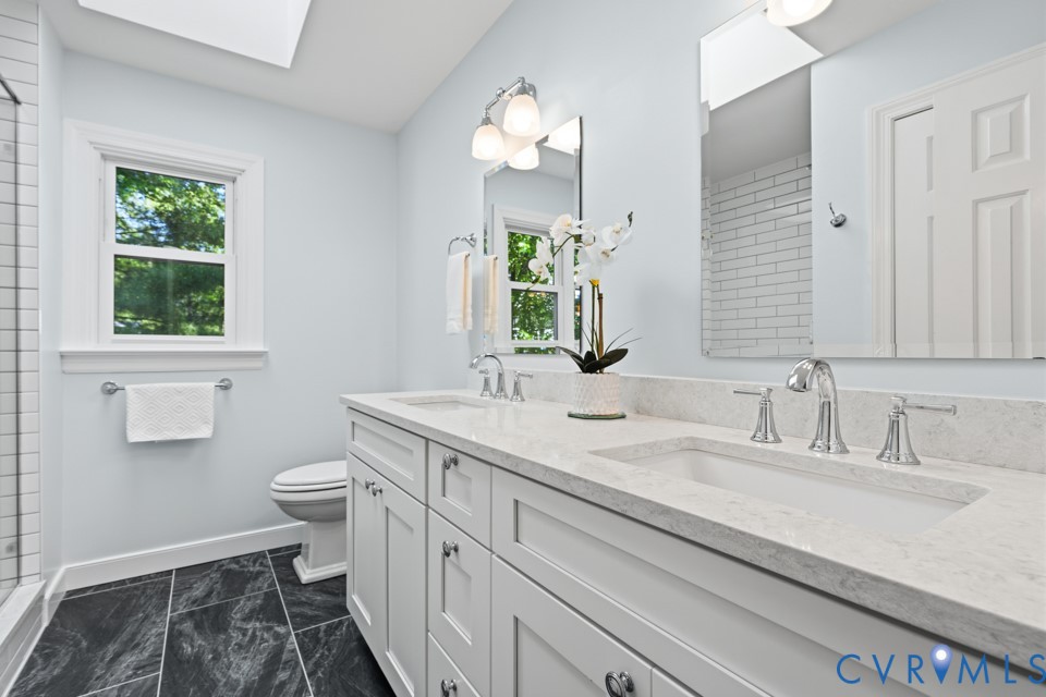 3009 Sable Road Henrico, VA 23233 - Photo 30 of 51 a bathroom with a sink and a mirror