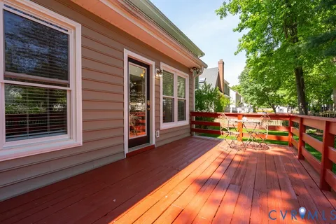 a front view of a house with a garden and plants