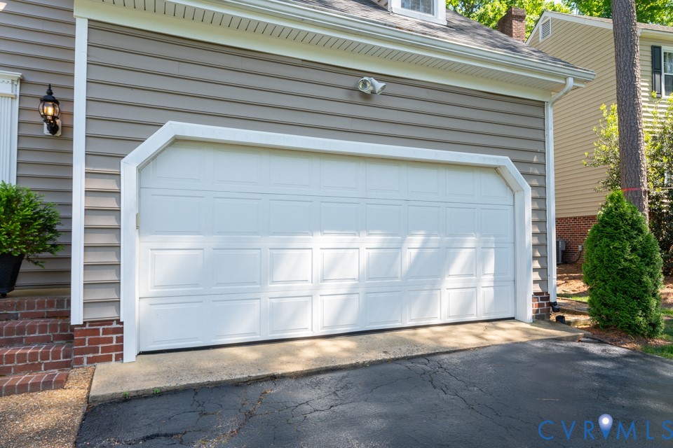 3009 Sable Road Henrico, VA 23233 - Photo 47 of 51 a front view of a house with a garage