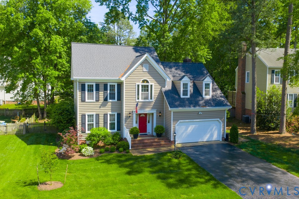 3009 Sable Road Henrico, VA 23233 - Photo 49 of 51 a front view of a house with a garden and plants
