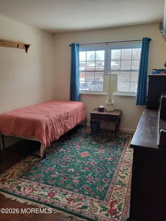 a bed room with a bed and a window